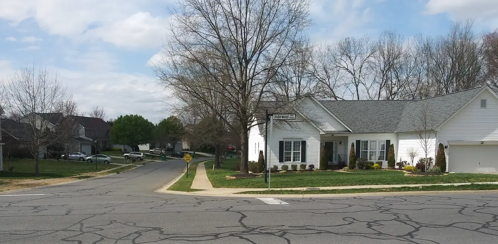 Street corner in an American suburb with a single family house